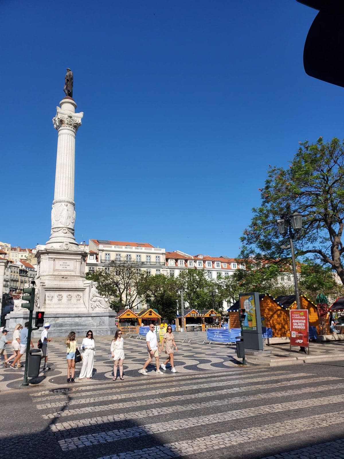 Rossio square in Lisbon under a clear blue sky