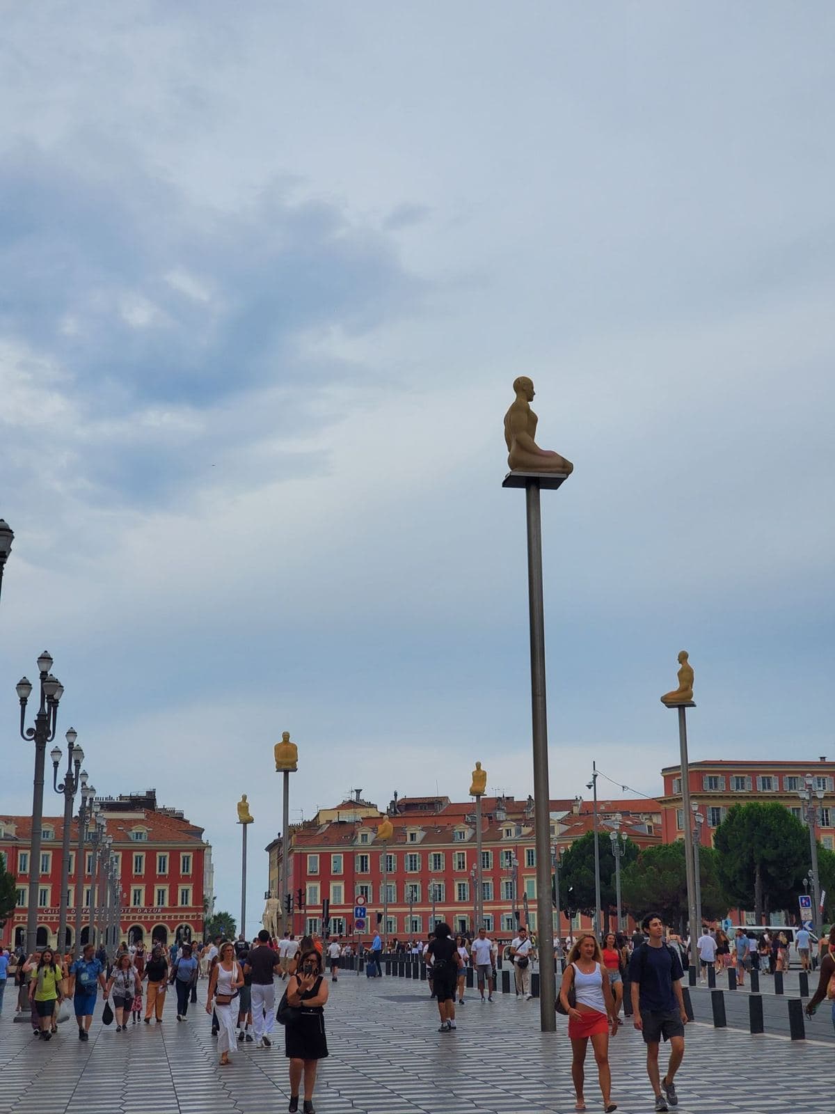 People crossing Place Masséna in Nice